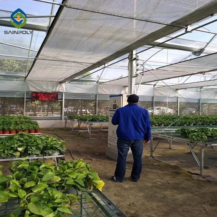 Sainpoly low cost multi span greenhouse Agricultural Equipment autom 40x100 Film greenhouse for sale