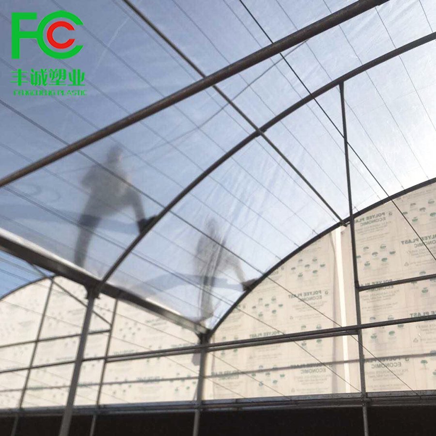 Wholesale waterproof/windproof clear plastic woven pe film,200 micron UV stabilized greenhouse woven film covering flowers