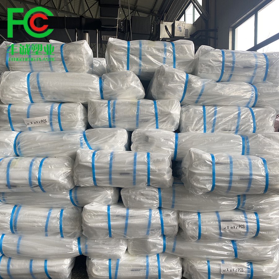 Wholesale waterproof/windproof clear plastic woven pe film,200 micron UV stabilized greenhouse woven film covering flowers