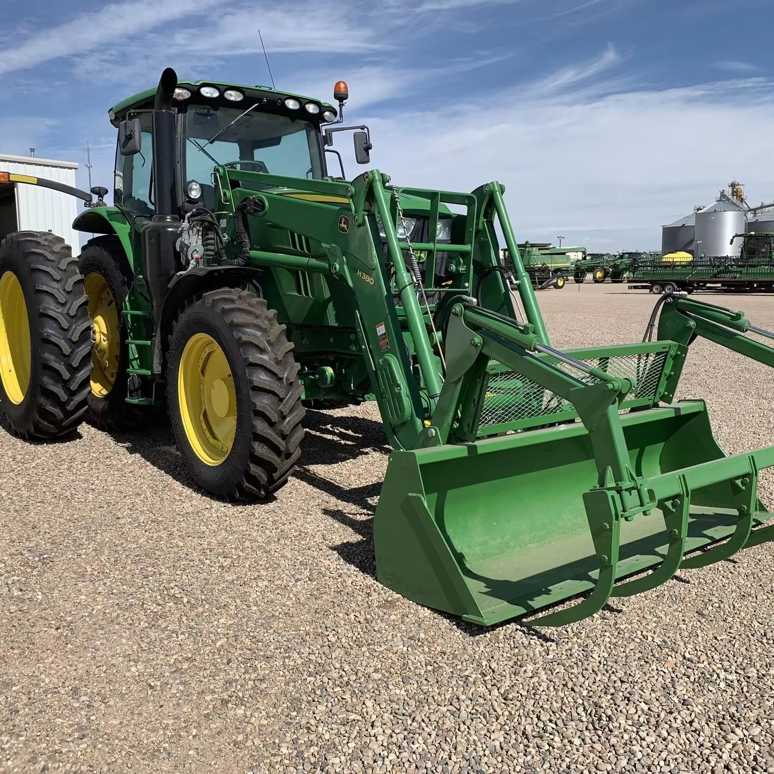 John Deeree 6175R Tractor With a Front Loader for Agricultural Machinery