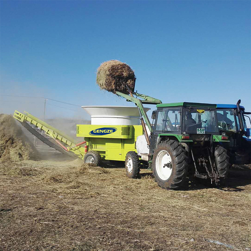 Large scale pasture ranchland using grass chopper machine for animals feed