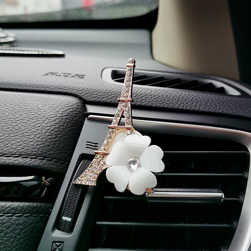 The air outlet of the car is air-conditioned and fragrant, and the perfume tower is decorated with flowers
