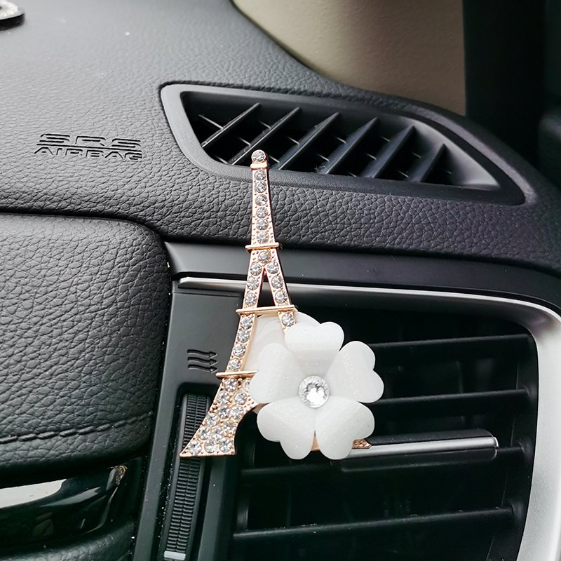 The air outlet of the car is air-conditioned and fragrant, and the perfume tower is decorated with flowers