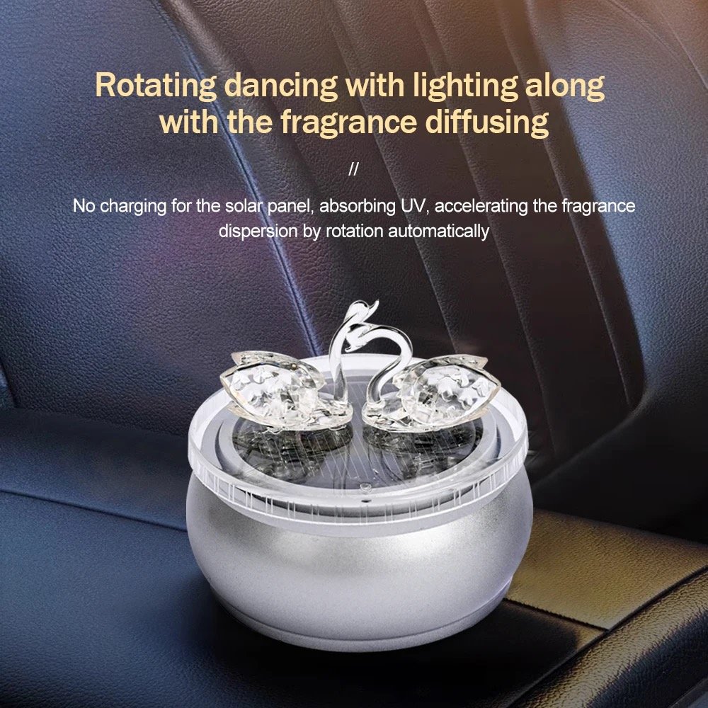 original design Beautiful swan solar rotating car decoration car aromatherapy for car