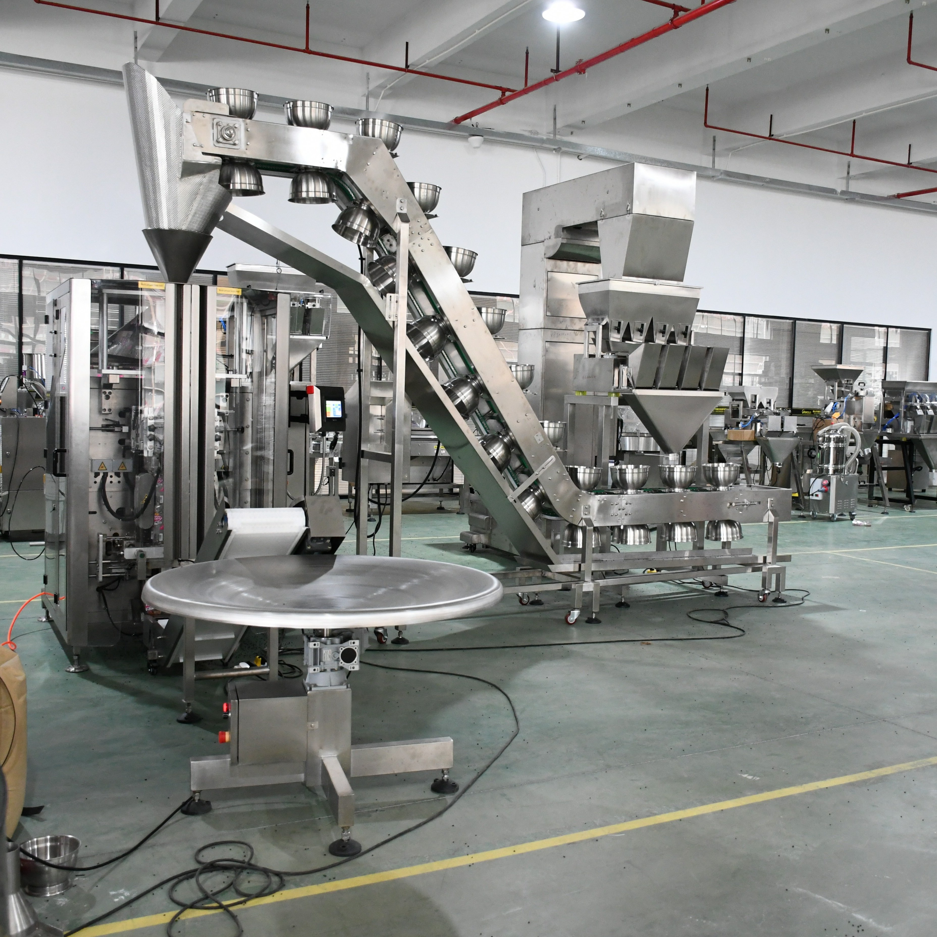 Guangdong Factory Automatic Granule Bagging Machine 4 Head Weigher Vertical Packing Machine for Sale