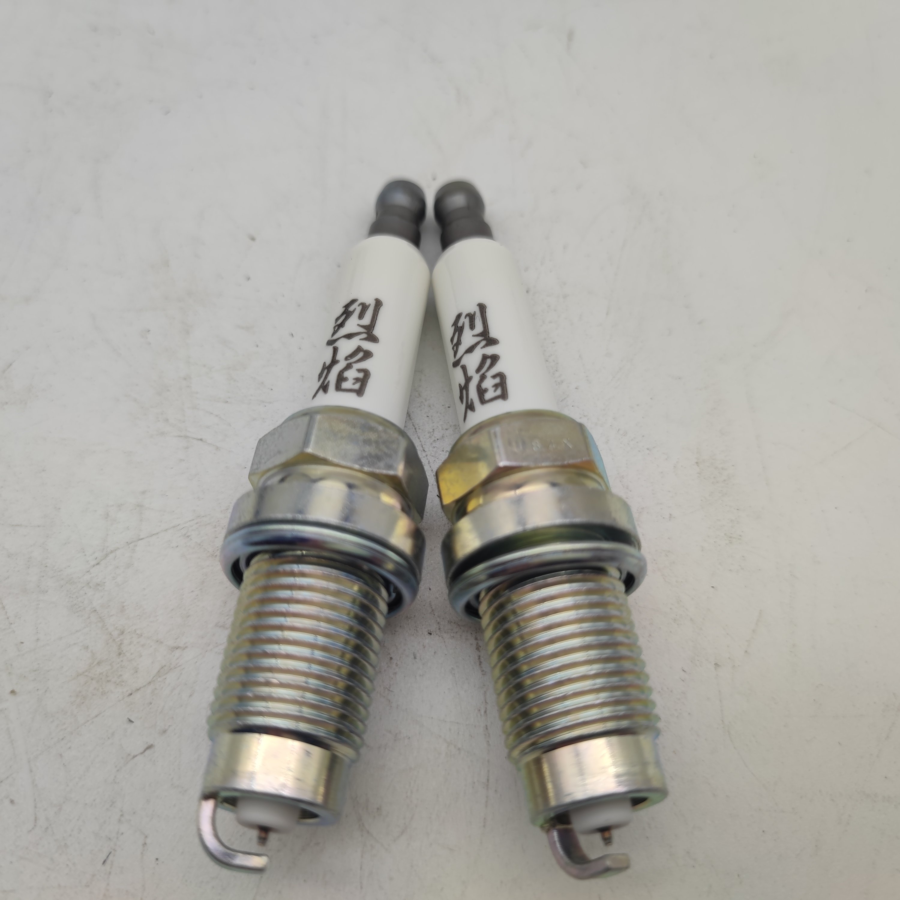 Automobile spark plugs Factory original price, suitable for common car models on the market Strong and durable