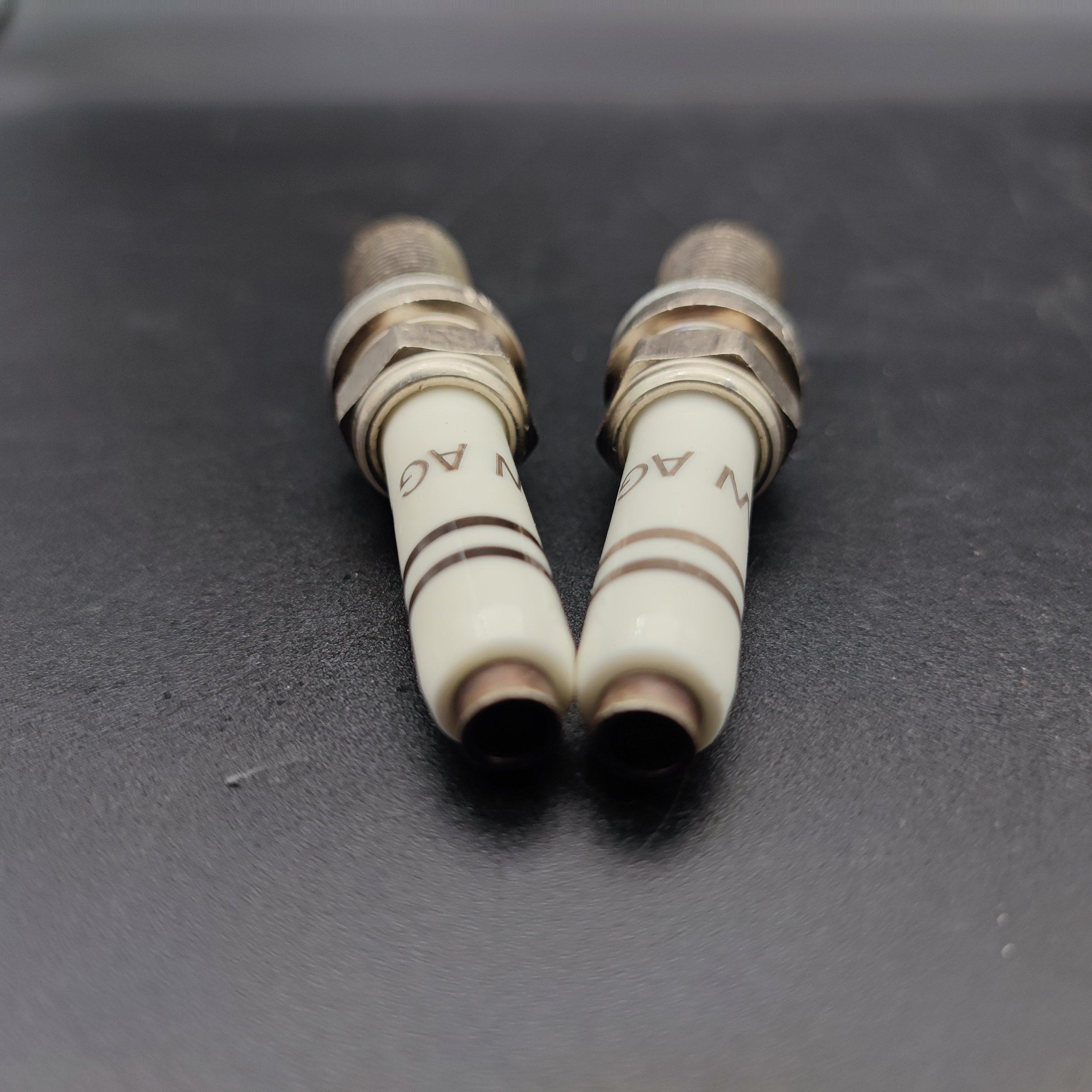 Automobile spark plugs Factory original price, suitable for common car models on the market Strong and durable