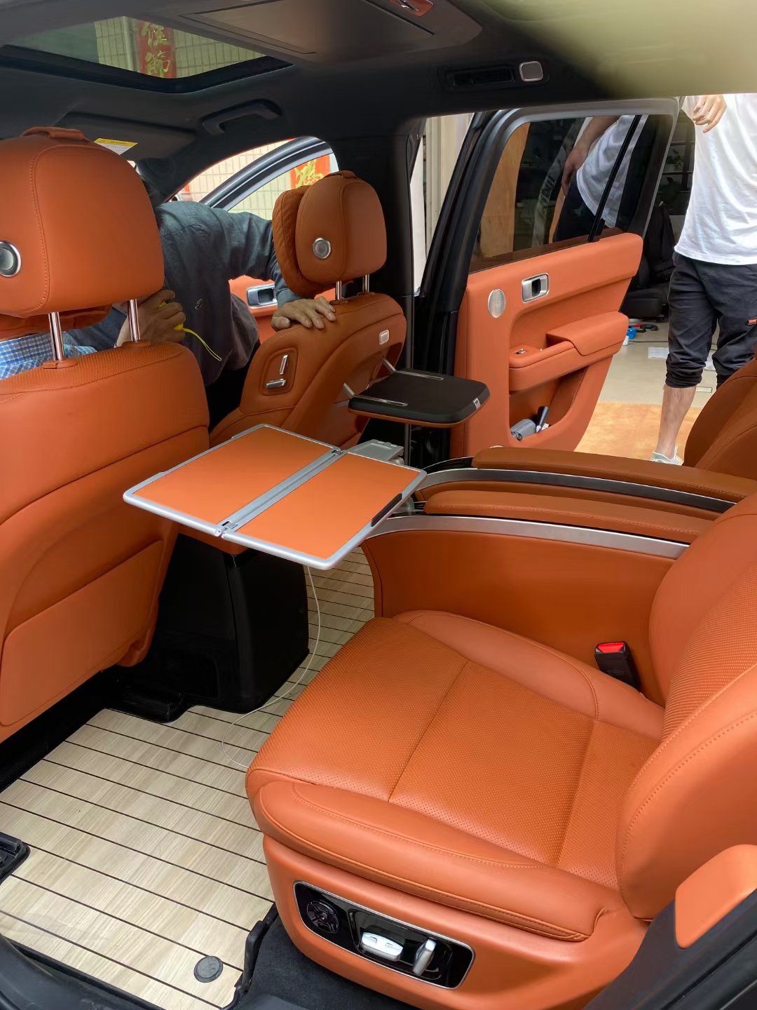 Single Side Folding Table Mounted on the Armrest of a Single Seat in Luxury Van