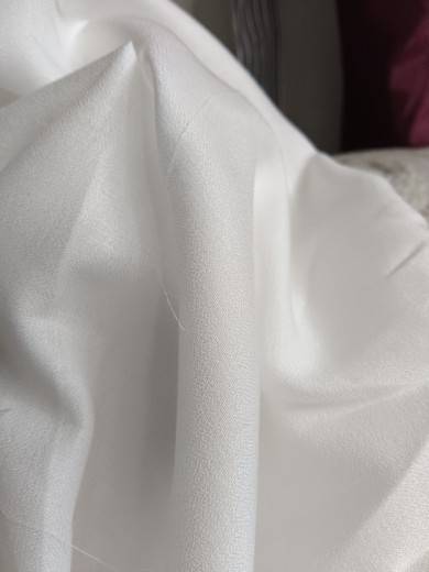 450 Castle Sand washing white, soft, soft, comfortable and slightly penetrated summer clothing fabric tail goods