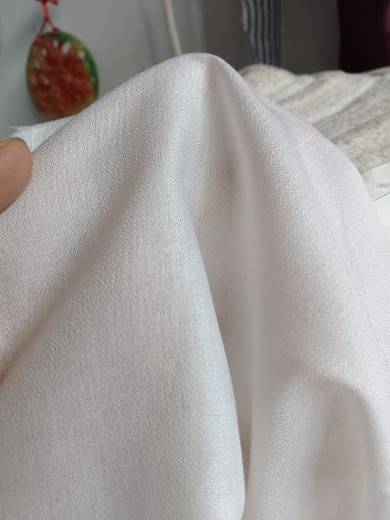 450 Castle Sand washing white, soft, soft, comfortable and slightly penetrated summer clothing fabric tail goods