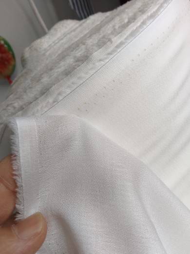450 Castle Sand washing white, soft, soft, comfortable and slightly penetrated summer clothing fabric tail goods