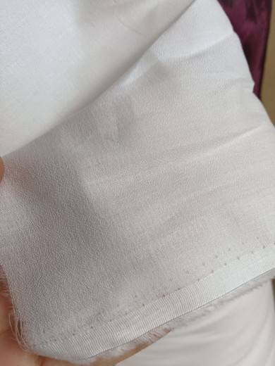450 Castle Sand washing white, soft, soft, comfortable and slightly penetrated summer clothing fabric tail goods