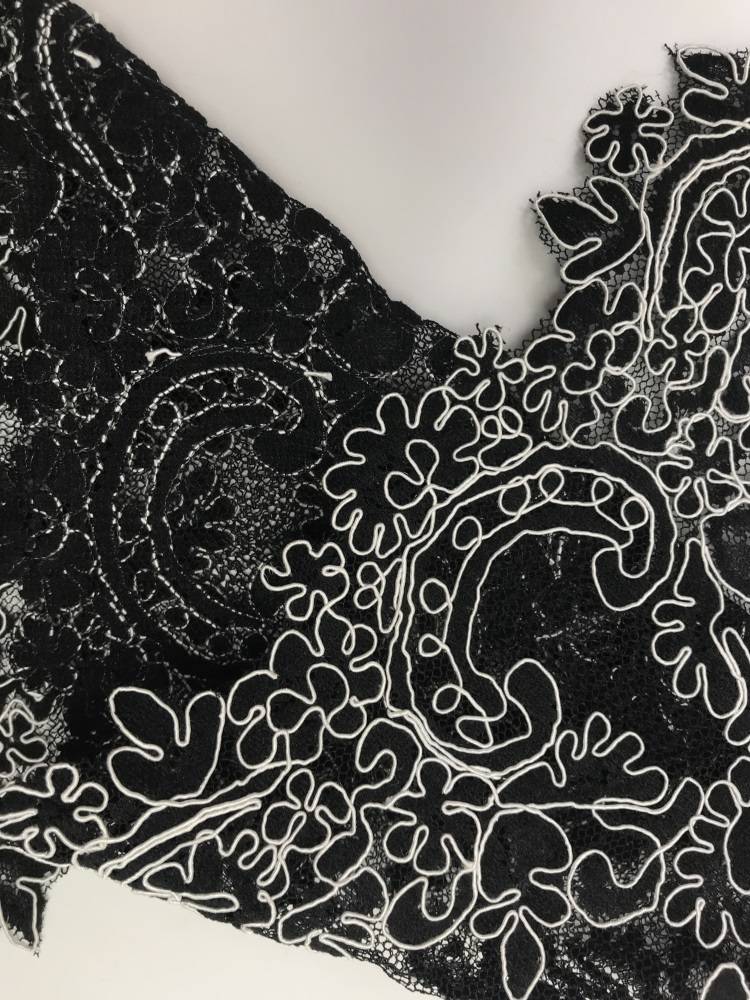 Black -and -white two -color car bone lace lace fabric is slightly thicker and lingering mid -to -high -end factories cloth head Yao Banniang