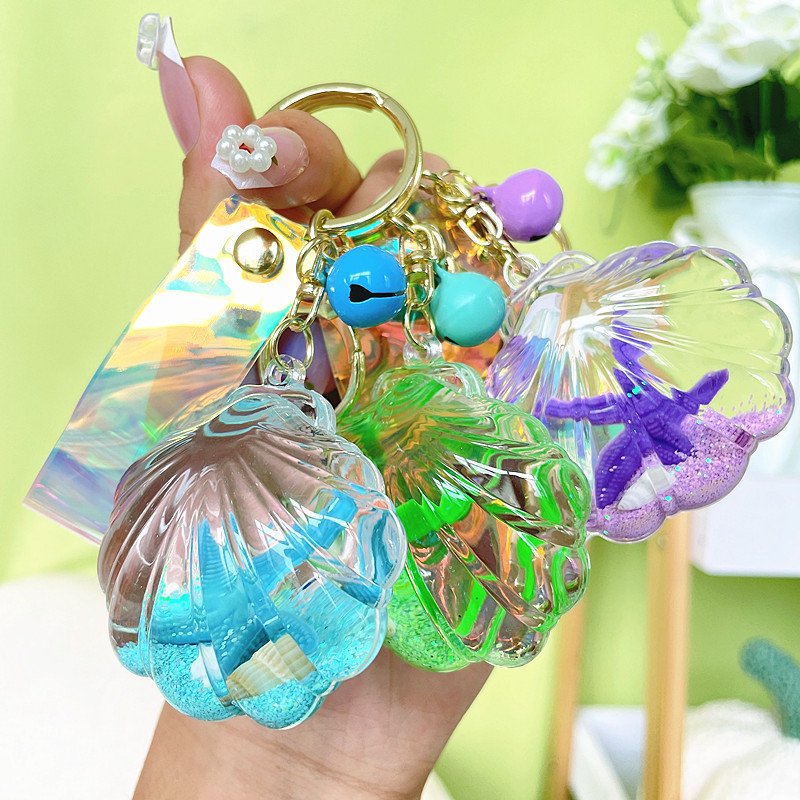 Creative acrylic Starfish shell keychain Fashion trend liquid quicksand pendant car key chain accessories girls bag decoration