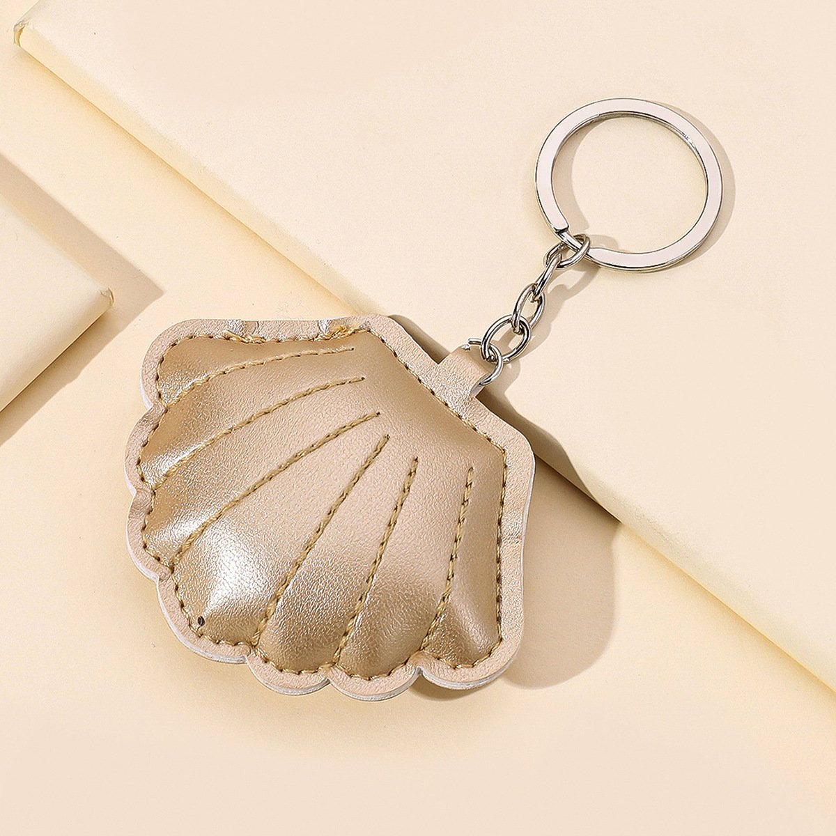 Hot sale PU filled cotton shell lady bag pendant clothing accessories gold leather shell car keychain