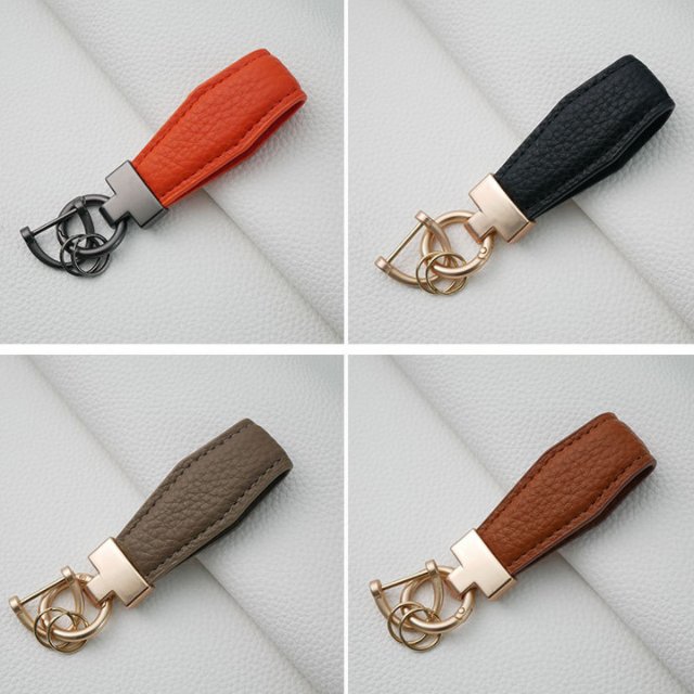 First layer calfskin car keychain Fashion leather keychain ring Alloy pendant Creative men's and women's leather lanyard