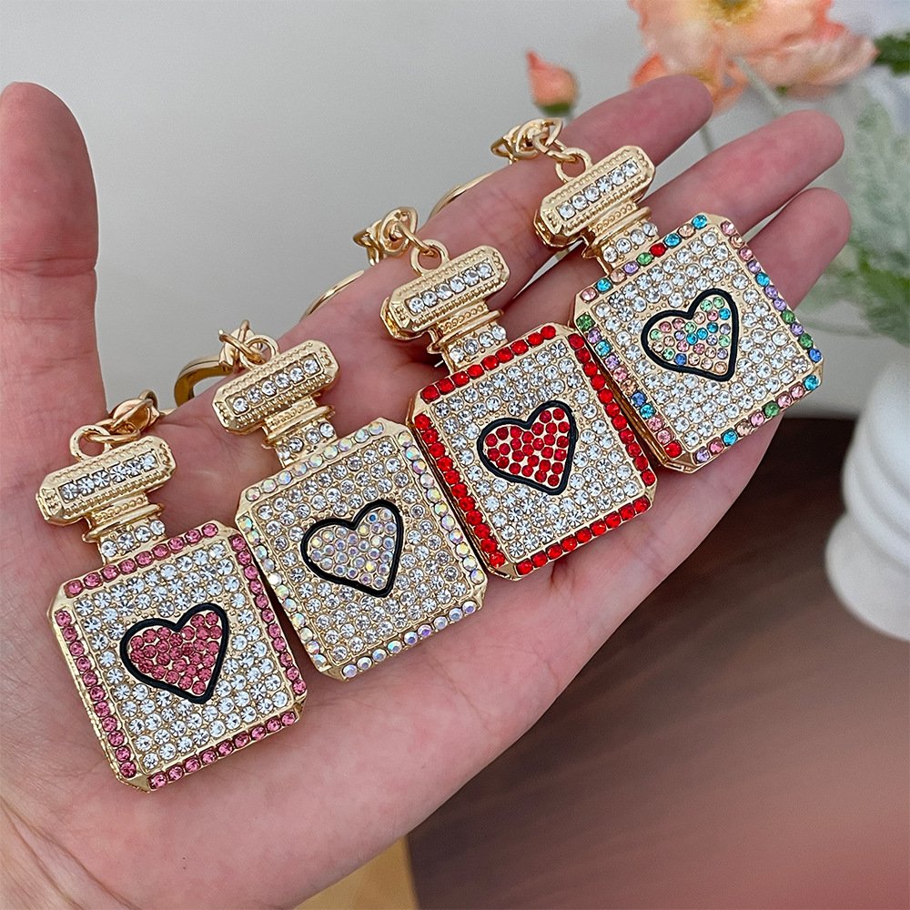 2024 New Arrival Paved Crystal Keyring Shiny Rhinestone Women Car Key Chain Cute Gold Plated Perfume Bottle Pendant Keychains