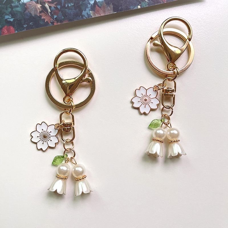 New fashion lily of the valley keychain Cute Metal enamel Orchid Sakura accessories Keychain Bag car key pendant