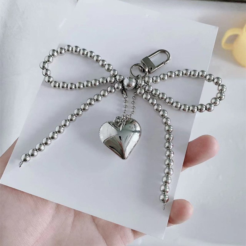 Wholesales Korean Chic New Sweet Pearl Bow Silver Love Pendant Car Keychain Airpods Pendant Phone strap