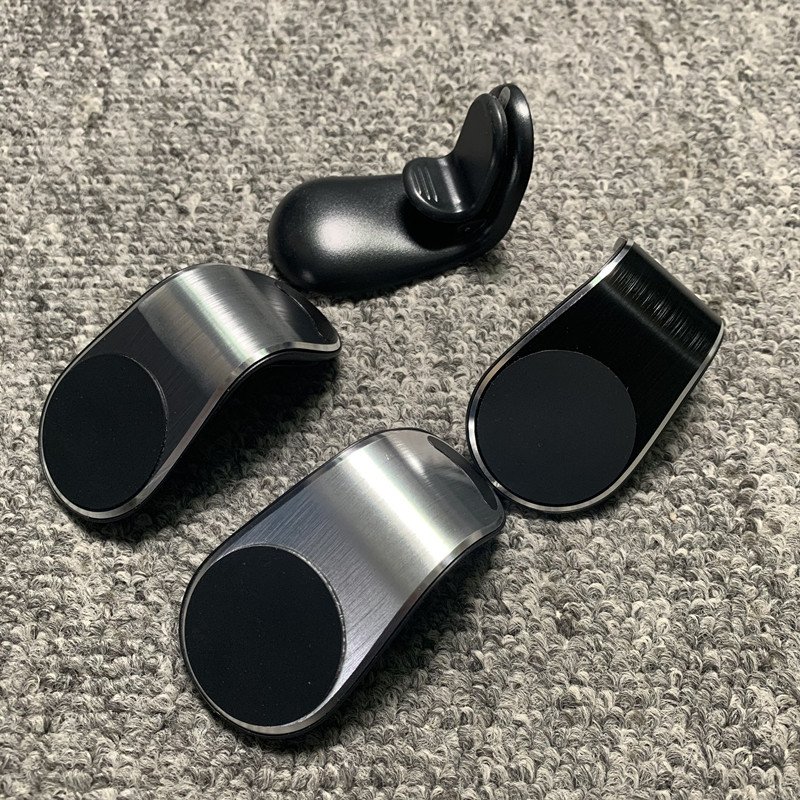 Car mobile phone rack magnetic suction navigation sucker type car air outlet supplies car inside creative strong magnetic holder