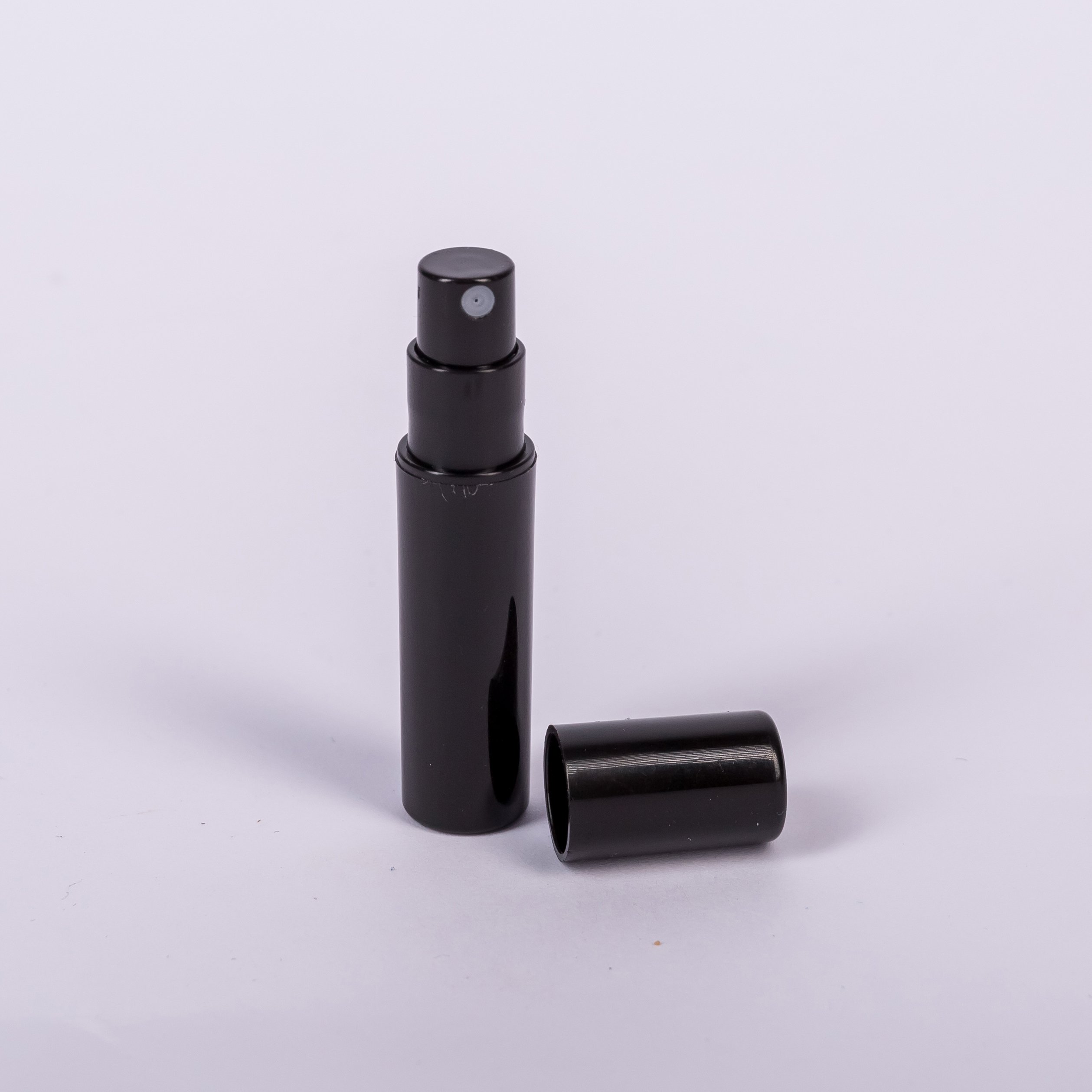 Cheap small nini plastic sprayer clear black white empty click cap portable 2ml perfume spray bottles