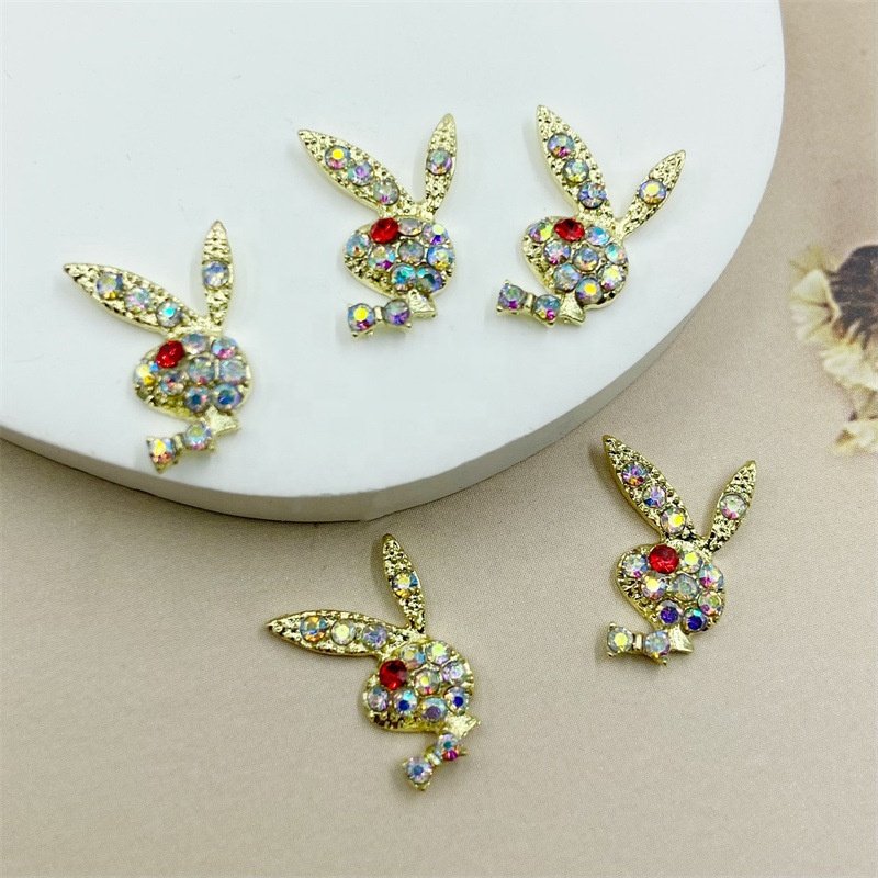 Qianya Luxury Alloy Gold Glitter Rabbit Heads Nail Charms Jewelry Luxury AB Color Nail Rhinestone Charms Diamond Gun Nail Decals