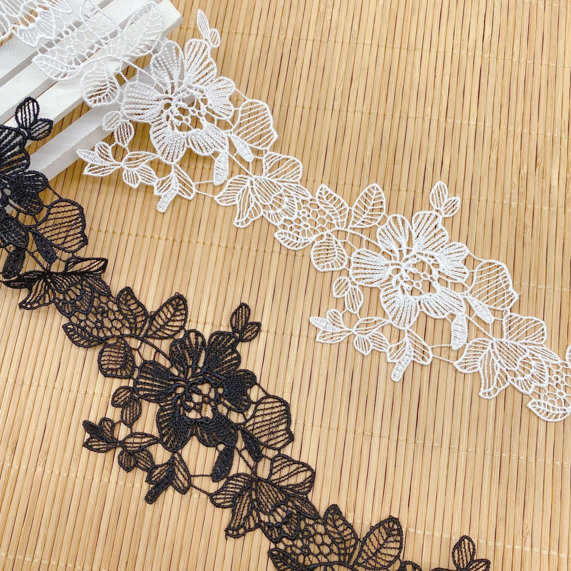 Spot wholesale price 100% polyester fiber rose design hollow lace trim for garment decoration