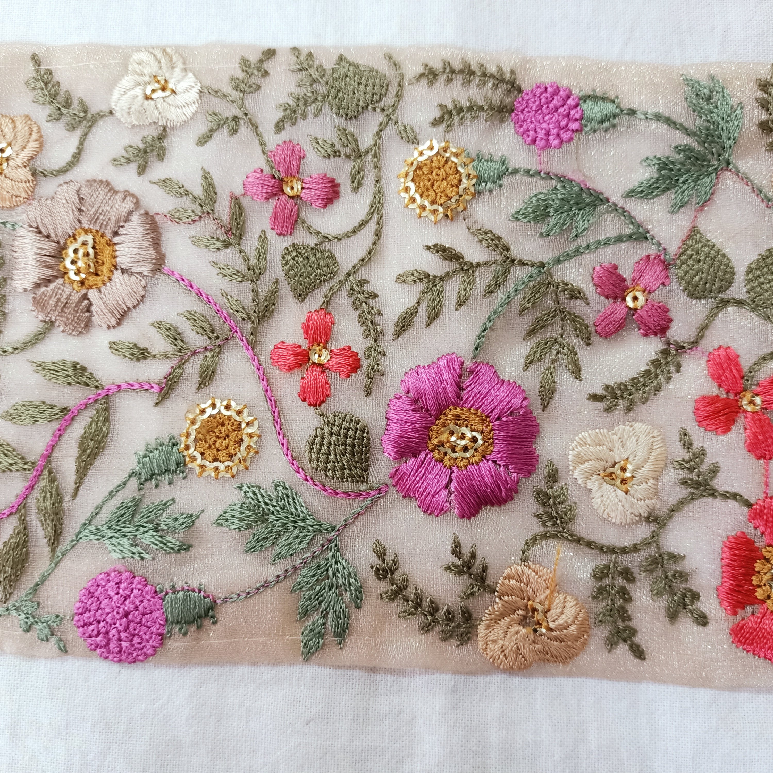 delicate floral embroidered ribbons with pastel colored flowers available in broad sizes suitable for use as trims and borders