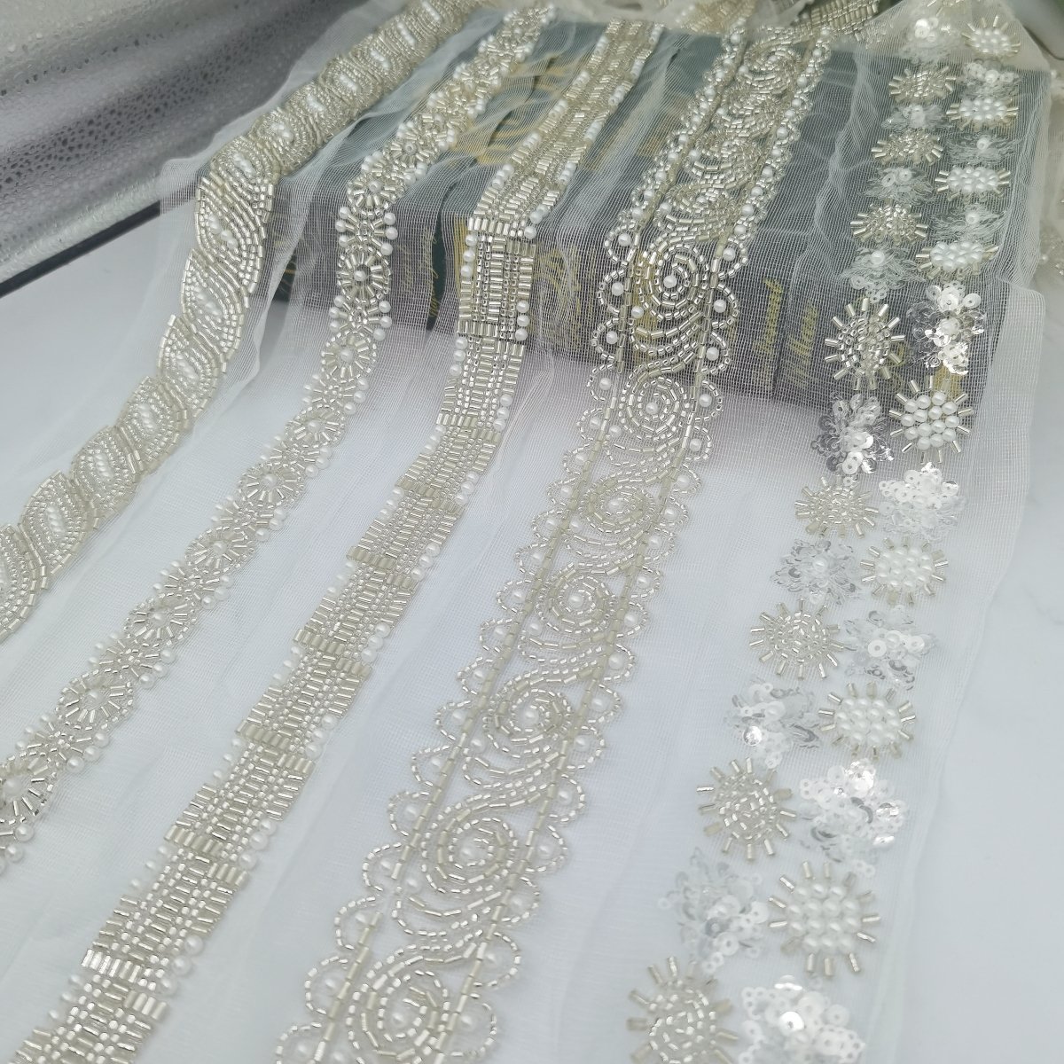 Guangdong Shantou Bao li Chi Milk lace clothing accessories fabric scarf robe belt wedding dress sequin beads white lace trim