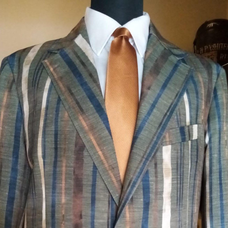 Striped tailored jacket with green/grey bottom in 100% made in Italy cotton suitable for all ages. Available from size 46 to 60.