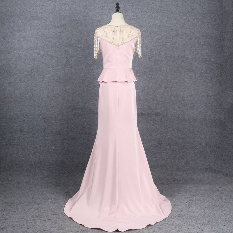 Fracked beaded evening dress covering the arm and covering the small belly