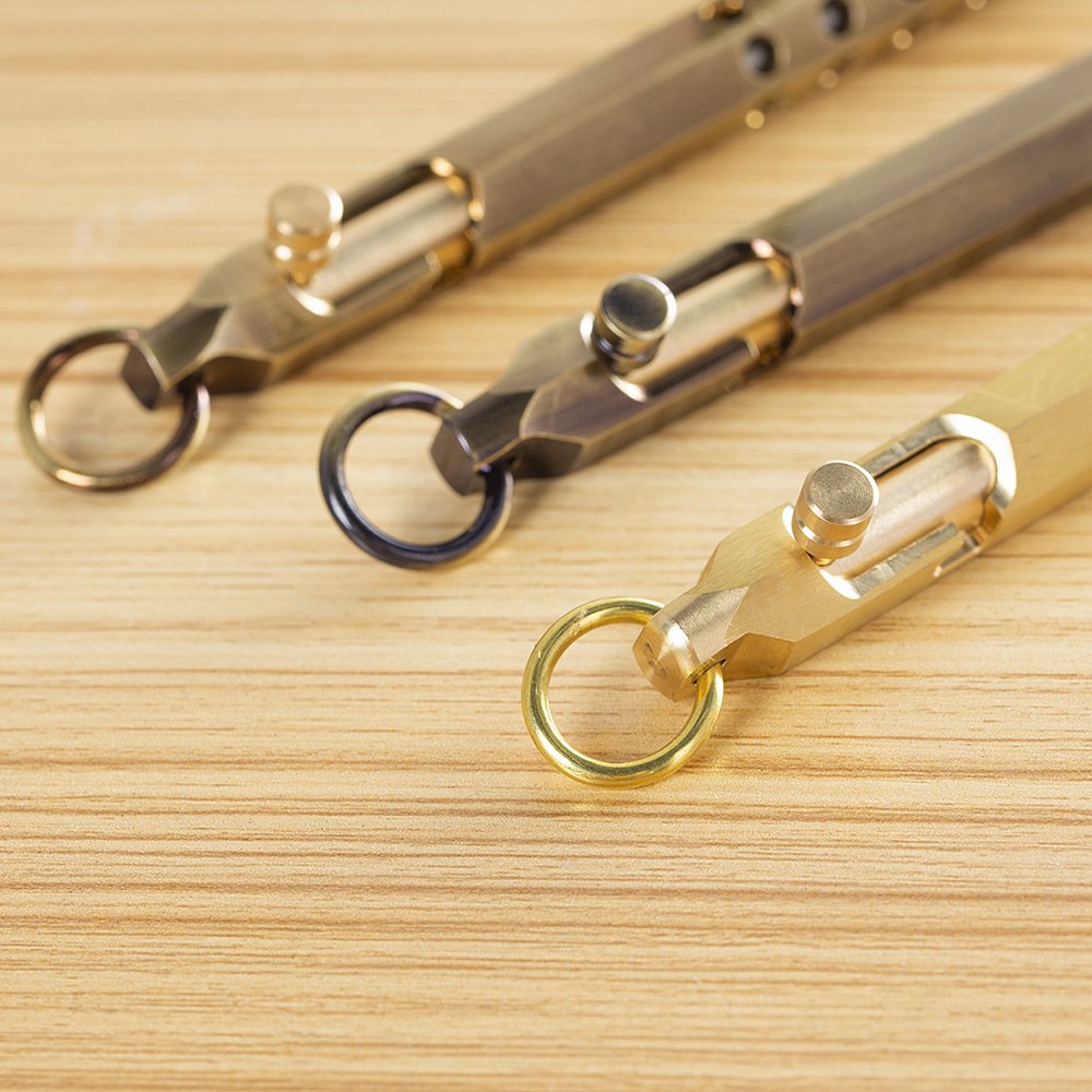 High End Hexagonal Bolt Action Trigger Switch Pen Metal Self-defense Supplies Brass Tactical Tool Portable EDC Pen with keyring