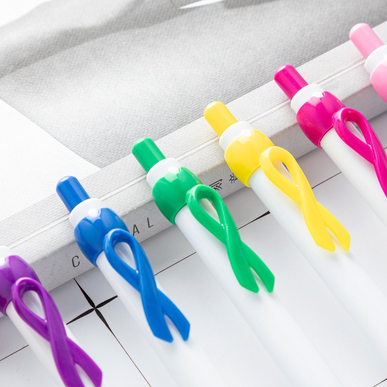 Pink ribbon bow clip ballpoint pen Red Cross AIDS public welfare breast cancer auxiliary advertising retractable pen