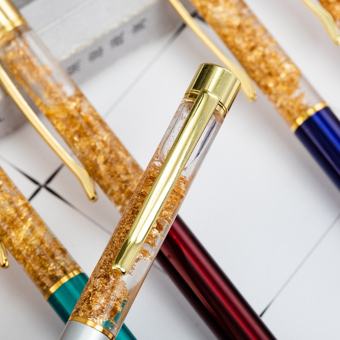 Custom Logo 24K Gold Glitter Floating Black Ink Ballpoint Pen for Gift Promotion