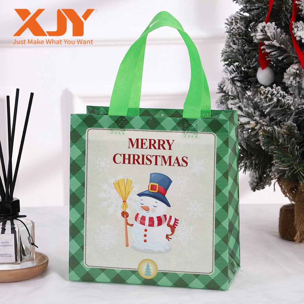 XJY Christmas Theme Children's Candy Handheld Gift Bags Cartoon Waterproof Nonwoven Paper UV Advantage Foil Embossed