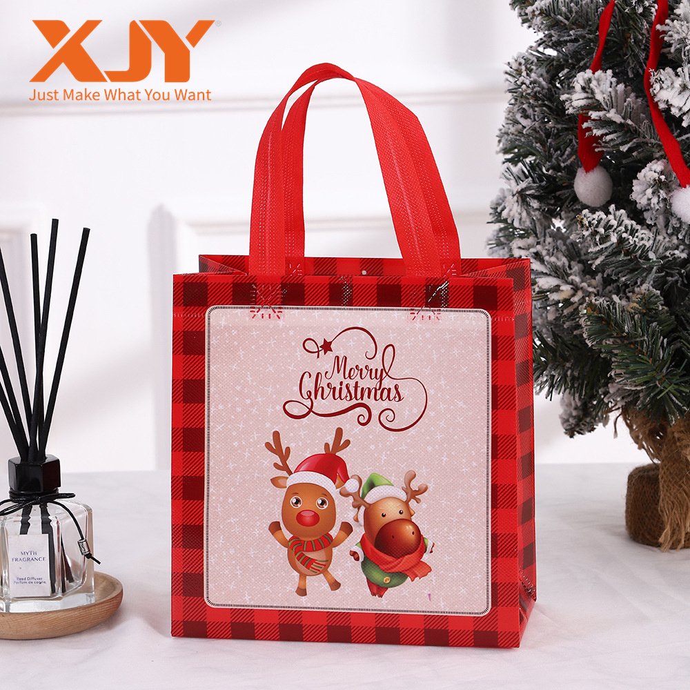 XJY Christmas Theme Children's Candy Handheld Gift Bags Cartoon Waterproof Nonwoven Paper UV Advantage Foil Embossed