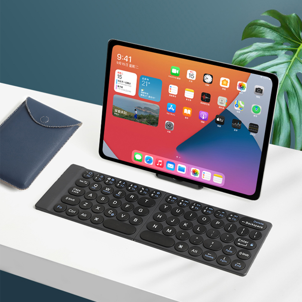 Foldable bluetooth mini keyboard with stand and packaging ultra-thin folding bluetooth keyboard