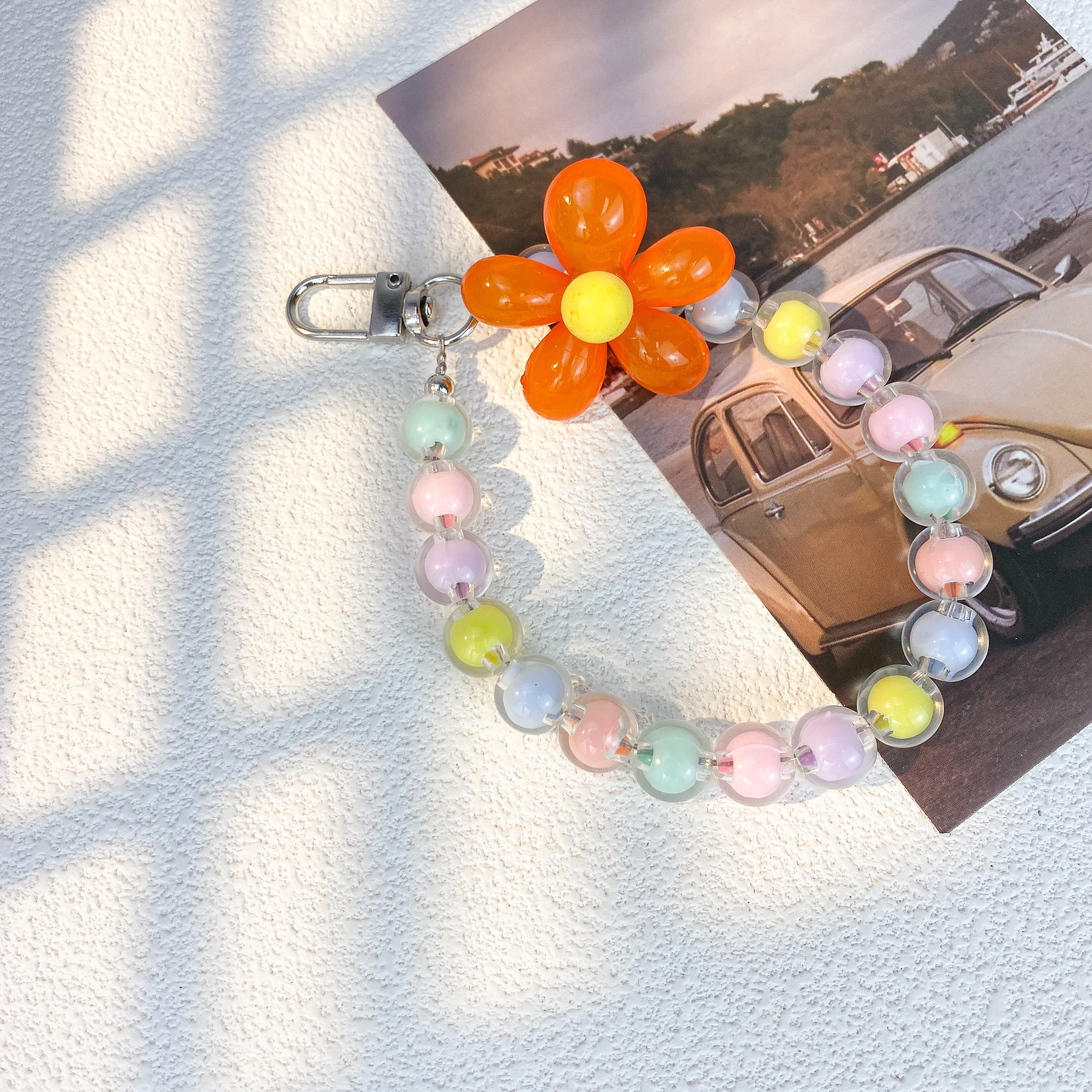 Wholesale Fashion Cute Multi-Color Macaron Beaded Phone Chain Anti-Loss Hand Wrist Lanyard with Flower Charms for Women Keychain