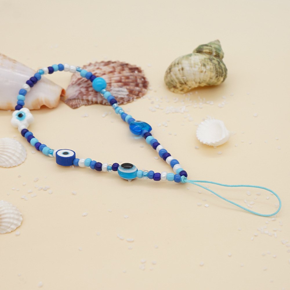 2022 Printed mobile phone lanyard 12mm white glaze eyes heart blue glass rice beads wrist mobile phone chain female