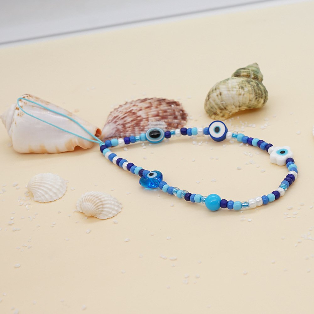 2022 Printed mobile phone lanyard 12mm white glaze eyes heart blue glass rice beads wrist mobile phone chain female