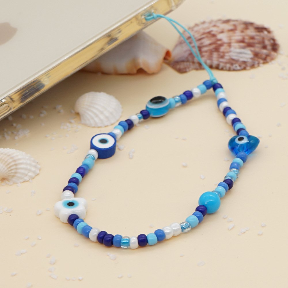 2022 Printed mobile phone lanyard 12mm white glaze eyes heart blue glass rice beads wrist mobile phone chain female