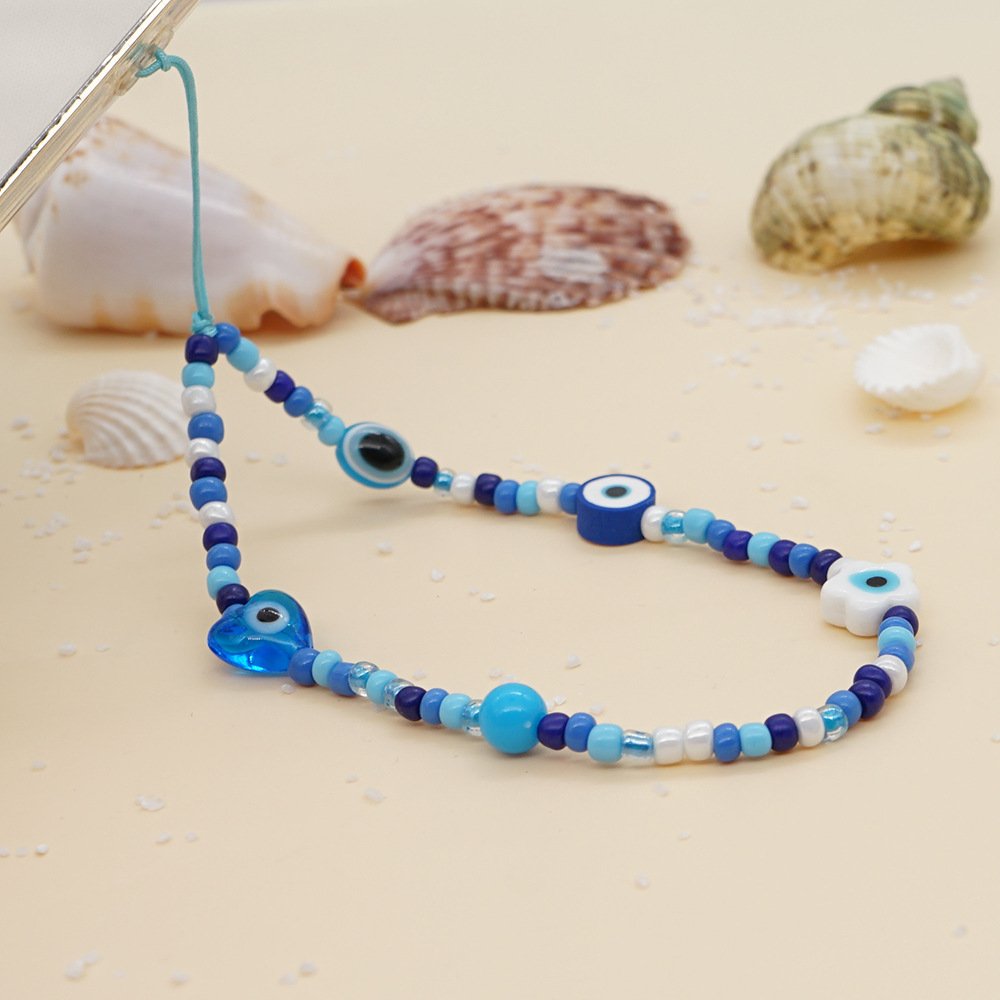 2022 Printed mobile phone lanyard 12mm white glaze eyes heart blue glass rice beads wrist mobile phone chain female