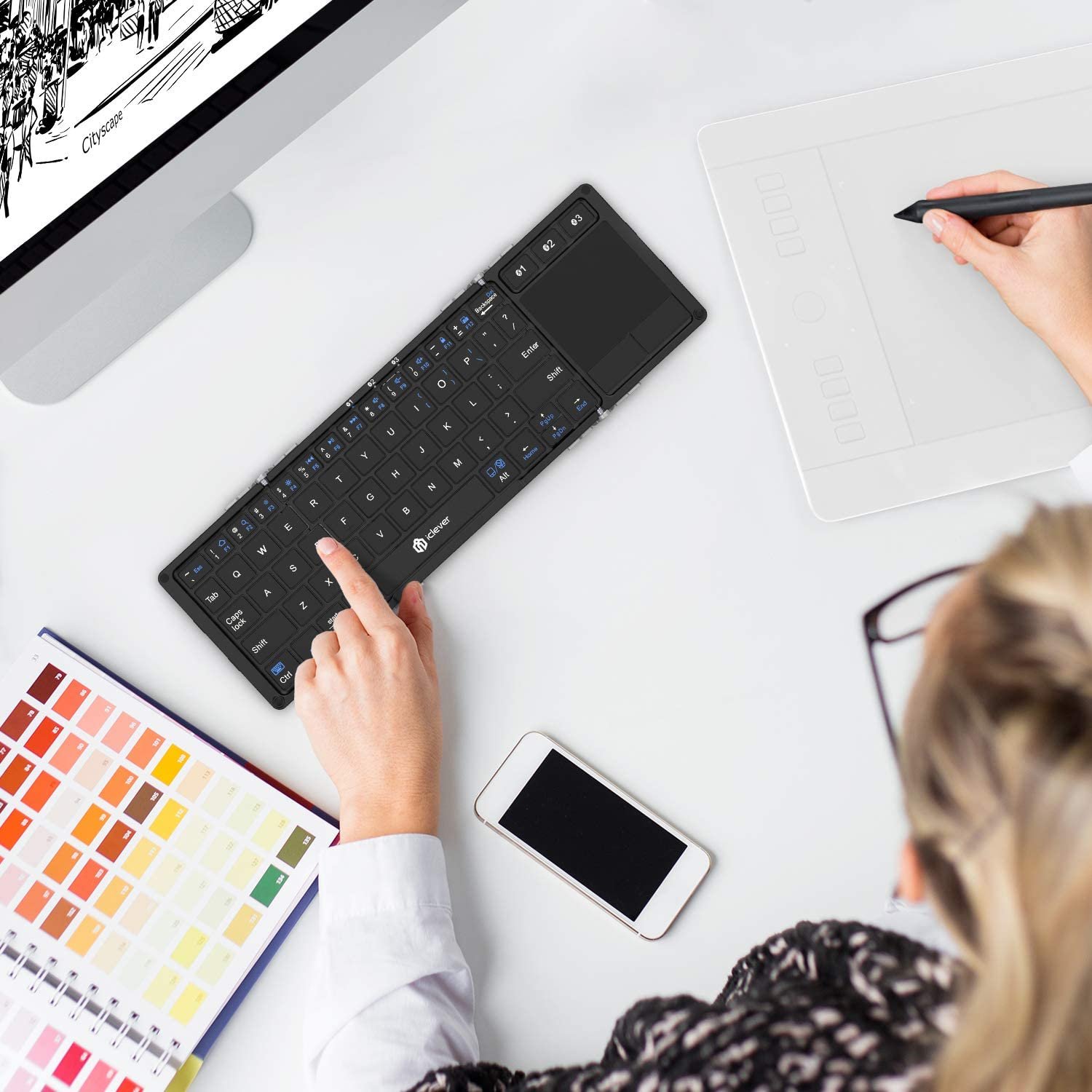 iClever BK08 Folding Keyboard Mini Portable Wireless Keyboard.