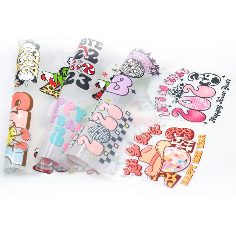 2023 New Year Plastisol Printable Clear Film Designs Flocking Sticker Logo Customize UV DTF Cup Wrap Transfers For Hoodies