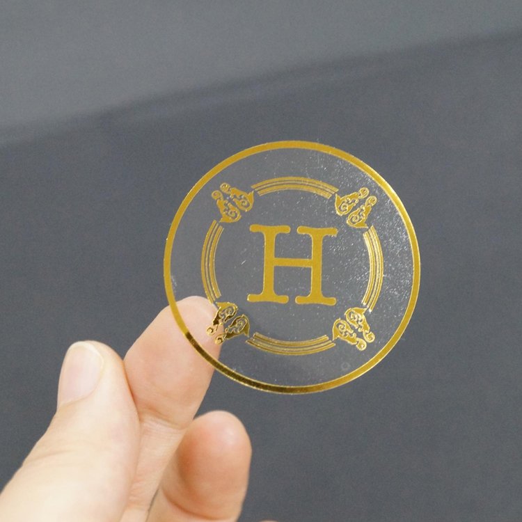 Custom Logo Printing Transparent Labels Clear Gold Foil Self Adhesive Sticker