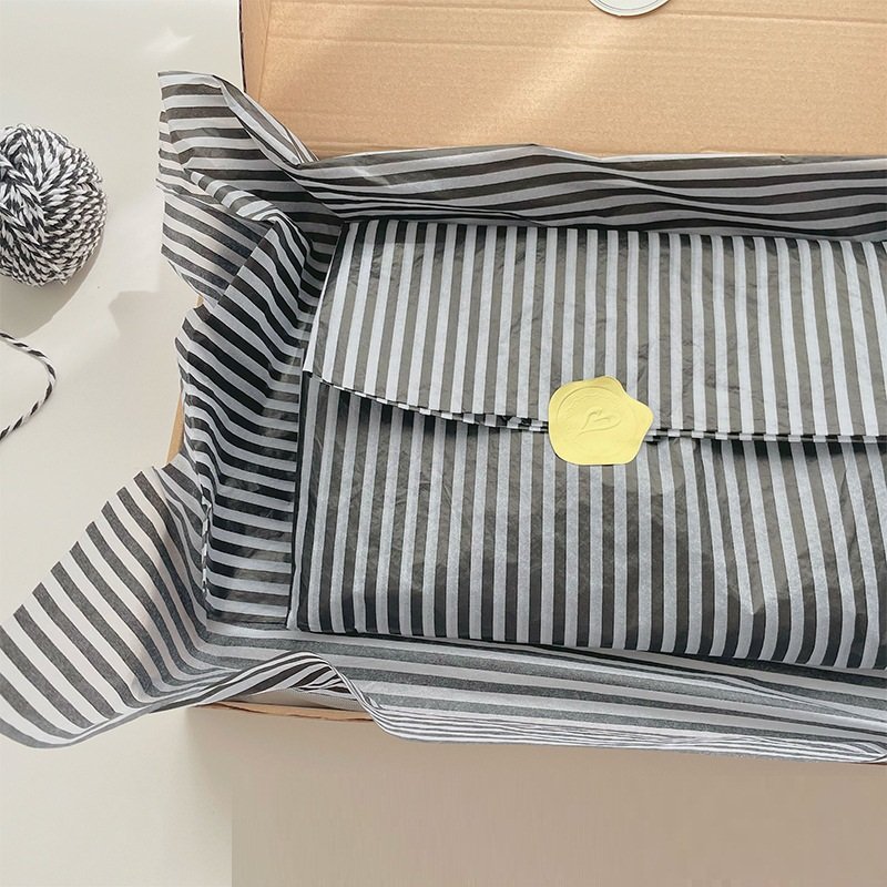 customised black and white striped tissue paper and stickers