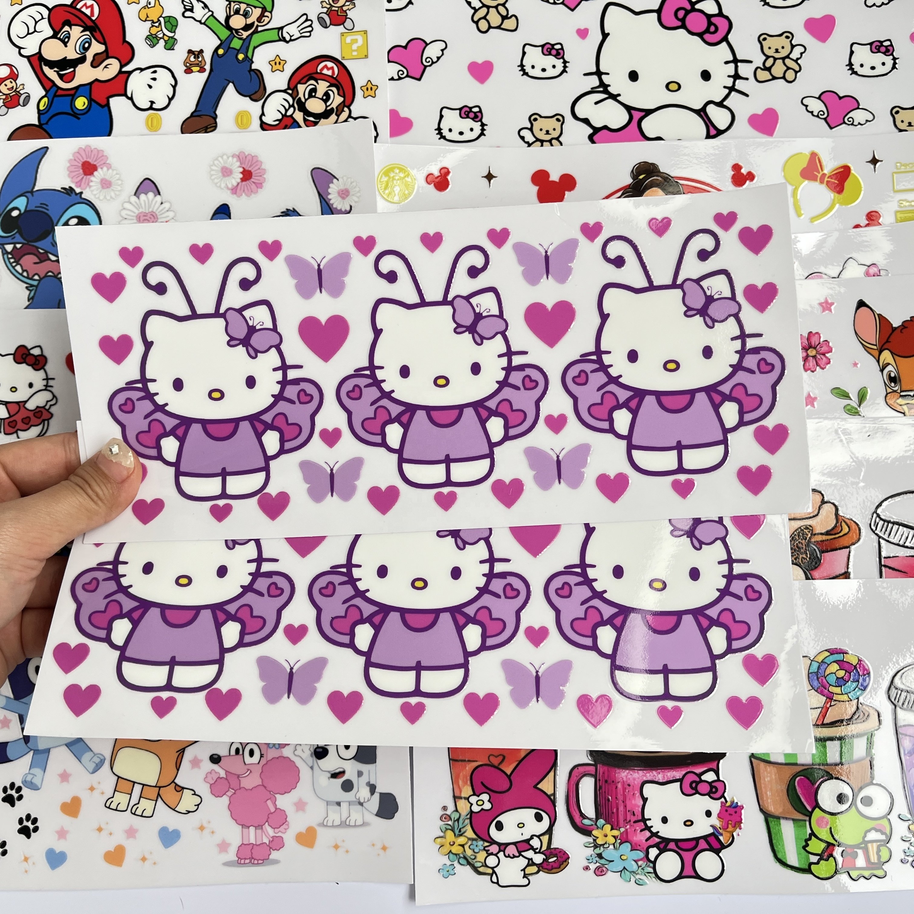 Wholesale factory cartoon labels heat transfer film printed on glass vinyl sticker printing uv dtf wraps 16oz for cups