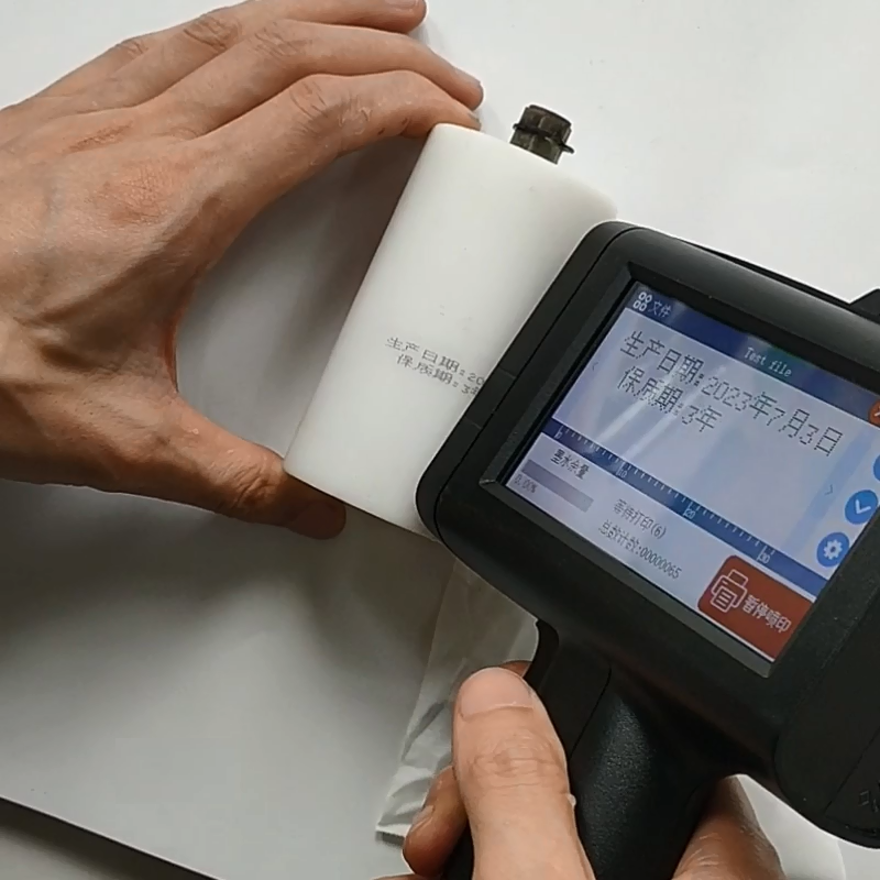 New arrival popular handheld printer gun multilingual QR code production date coding machine for bottle glass textile bag