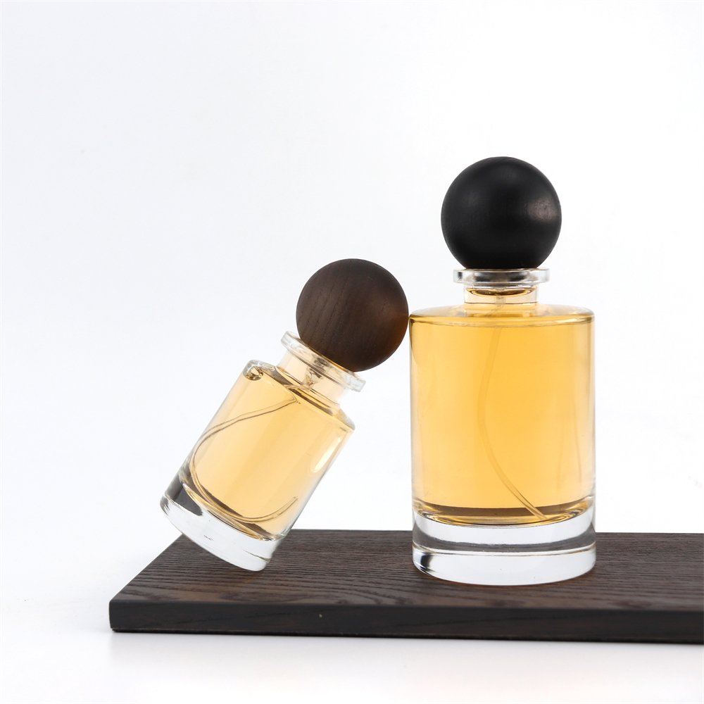New Style Various Perfume Bayonet Bottle Cylinder Thick Bottom 100ml Glass Perfume Bottle with Black Wooden Round Ball Cover
