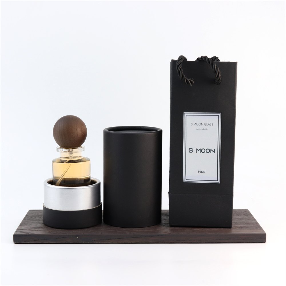 New Style Various Perfume Bayonet Bottle Cylinder Thick Bottom 100ml Glass Perfume Bottle with Black Wooden Round Ball Cover